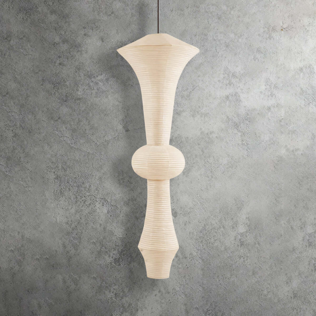 Three white Washi paper pendant light variants displayed side by side against a textured gray background