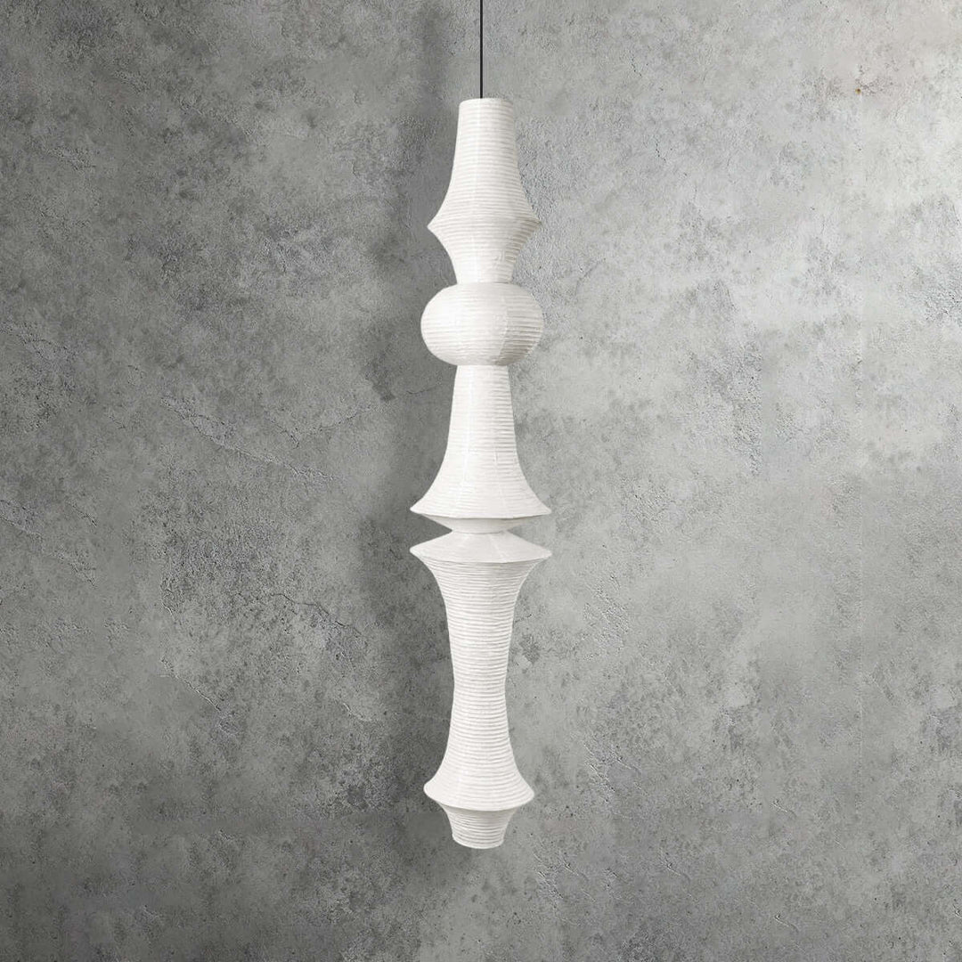 Yellowish Washi paper pendant light with a narrow geometric top, rounded center and tapered lower shade