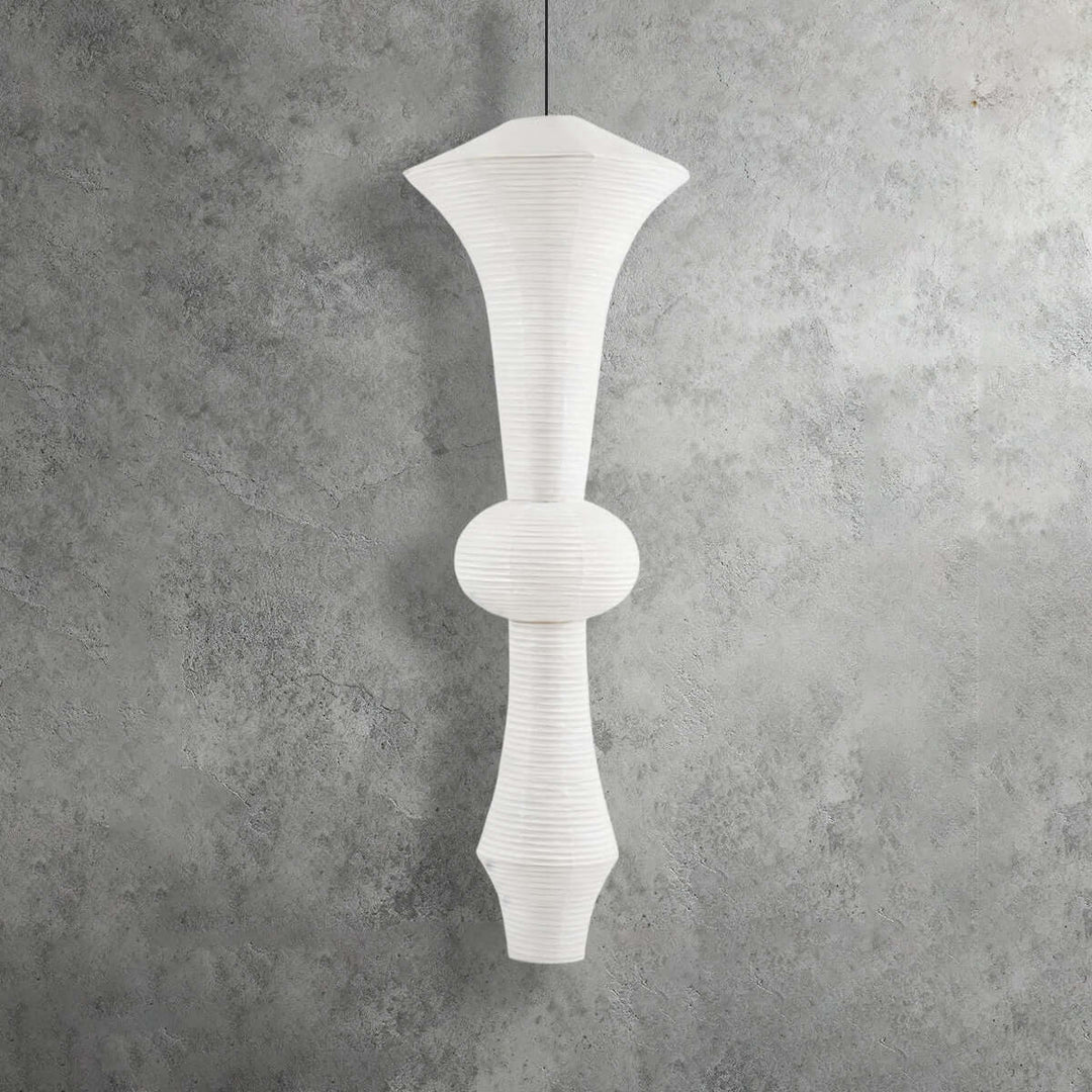 Tall yellowish Washi paper pendant light with a globe center and layered sculptural shade profile