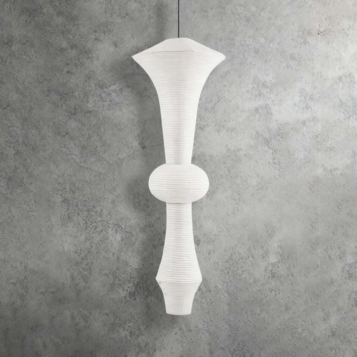 Tall yellowish Washi paper pendant light with a globe center and layered sculptural shade profile