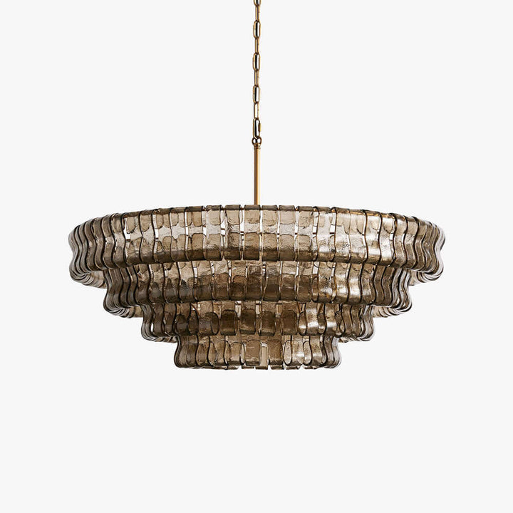 Smoky glass round chandelier with tiered wavy panels and a gold chain on a light background