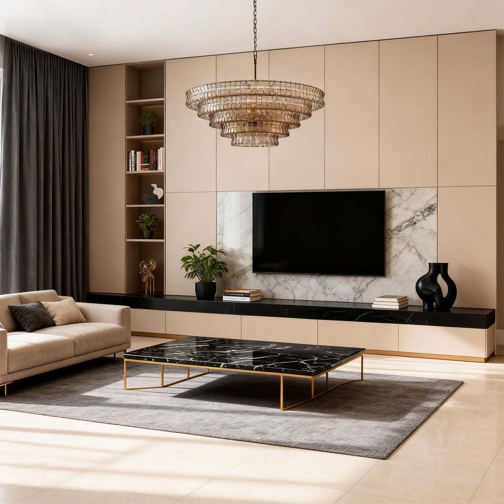Tiered glass chandelier above a modern living room with a TV wall and marble coffee table