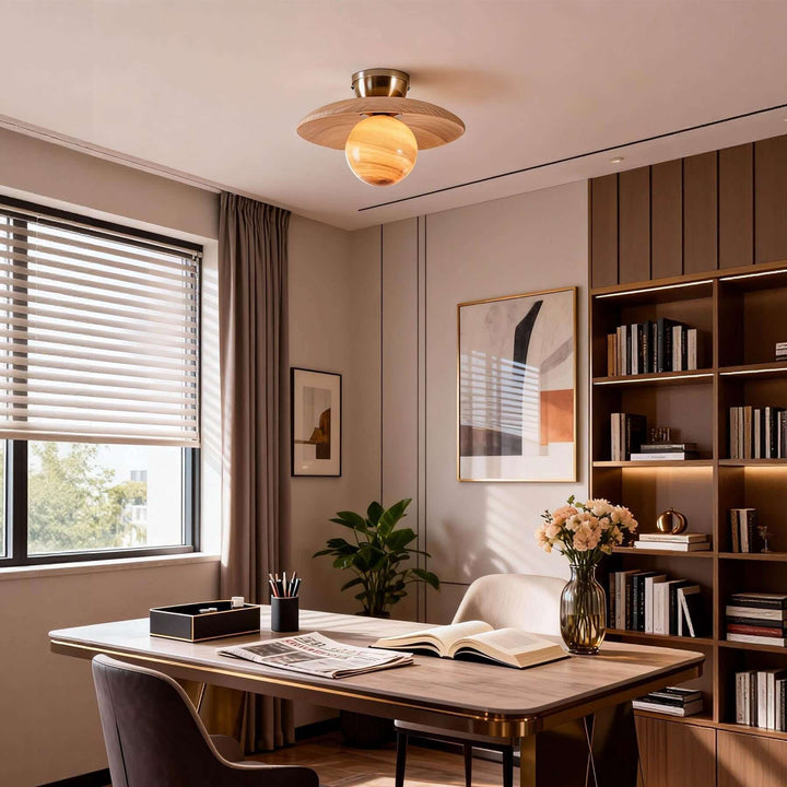 Beige Zolira ceiling lamp with an amber glass globe in a modern home office