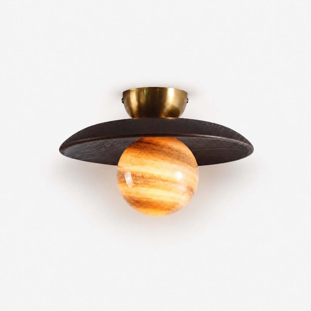 Zolira ceiling lamp with a dark wood canopy, brass mount, and glowing amber art glass globe