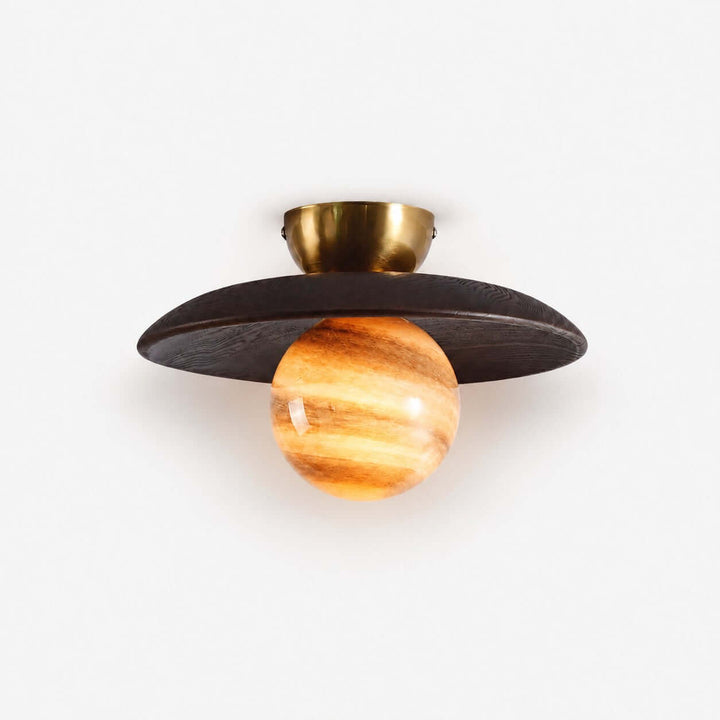 Zolira ceiling lamp with a dark wood canopy, brass mount, and glowing amber art glass globe