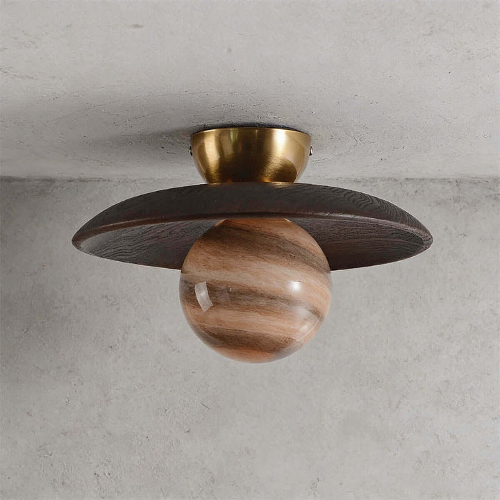 Unlit brown Zolira ceiling lamp showing its dark wood canopy, brass mount, and marbled glass globe