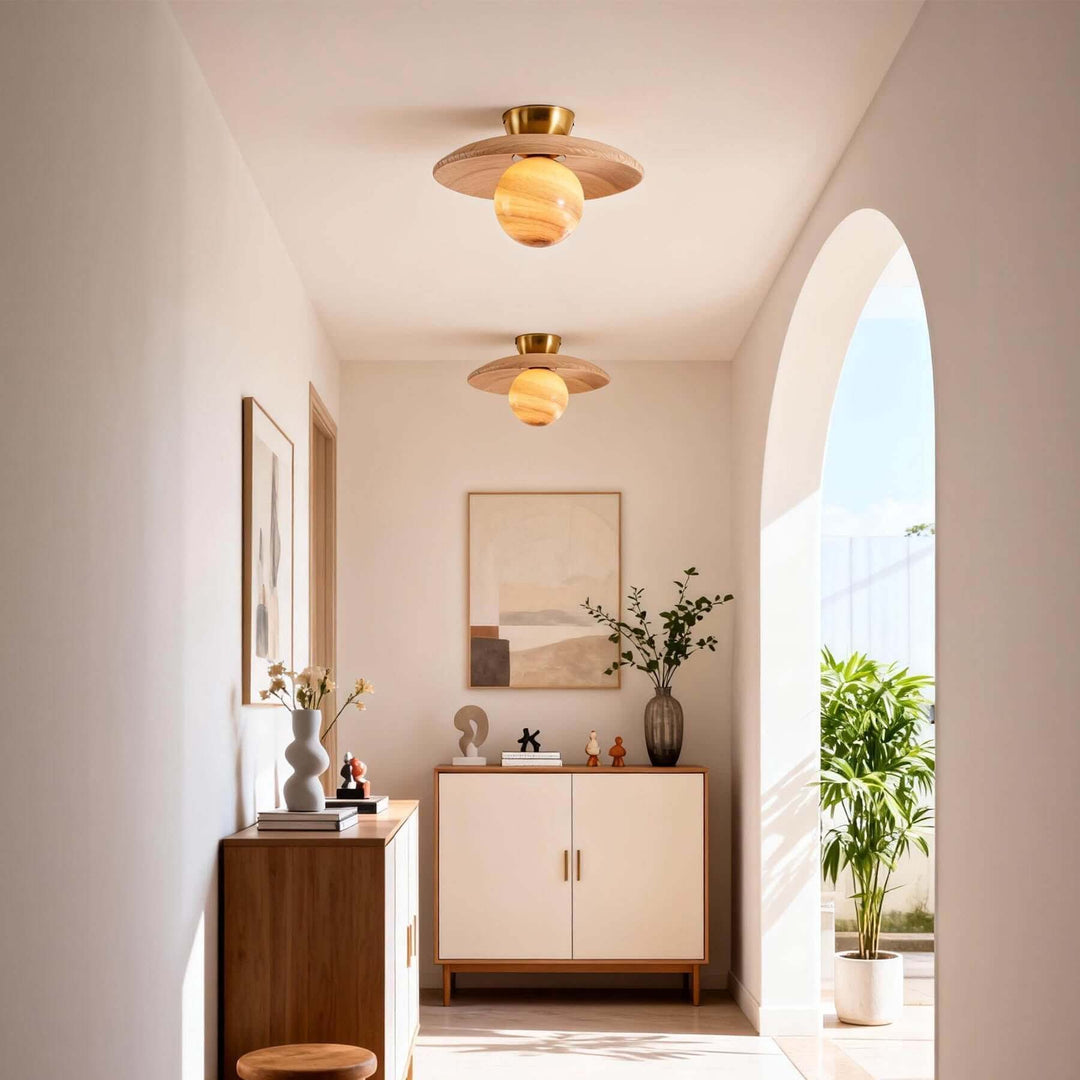 Pair of beige Zolira ceiling lights illuminating a bright hallway with wood storage cabinets