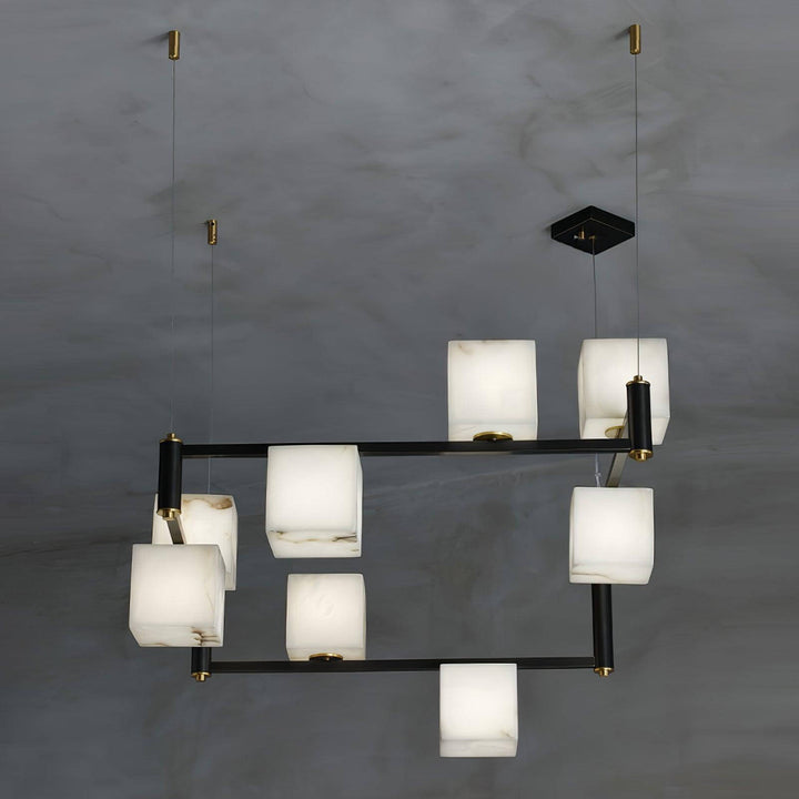 Mid century modern alabaster square box chandelier with black accents and varying alabaster patterns.