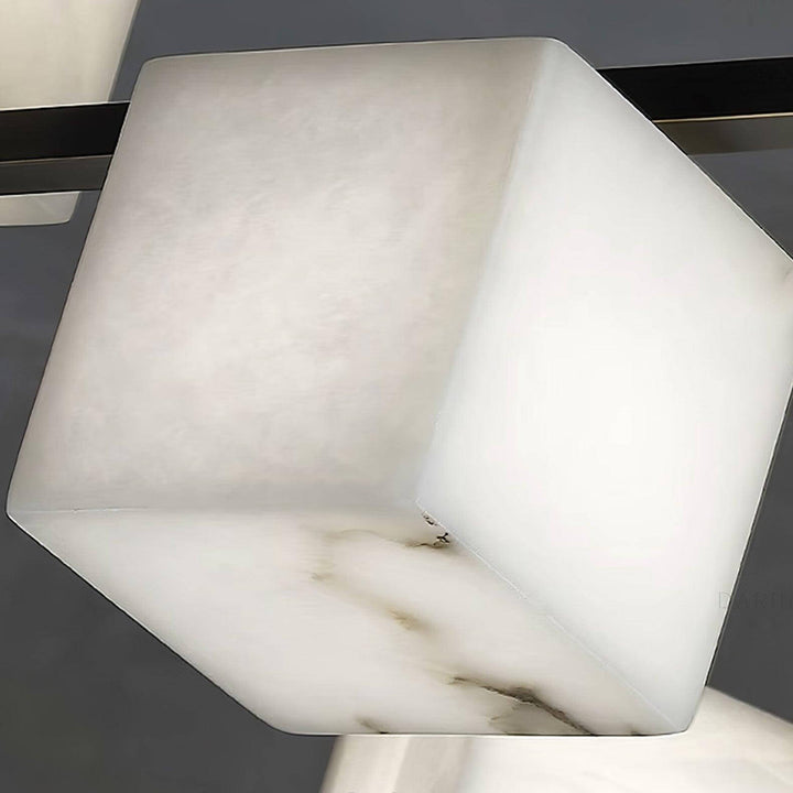 Close-up of alabaster cube light from a mid-century modern chandelier, showcasing unique patterns and a sleek design.