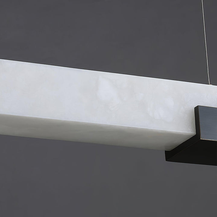 Cary Alabaster Pendant Light showcasing unique alabaster patterns and modern black accents for contemporary kitchen island lighting.
