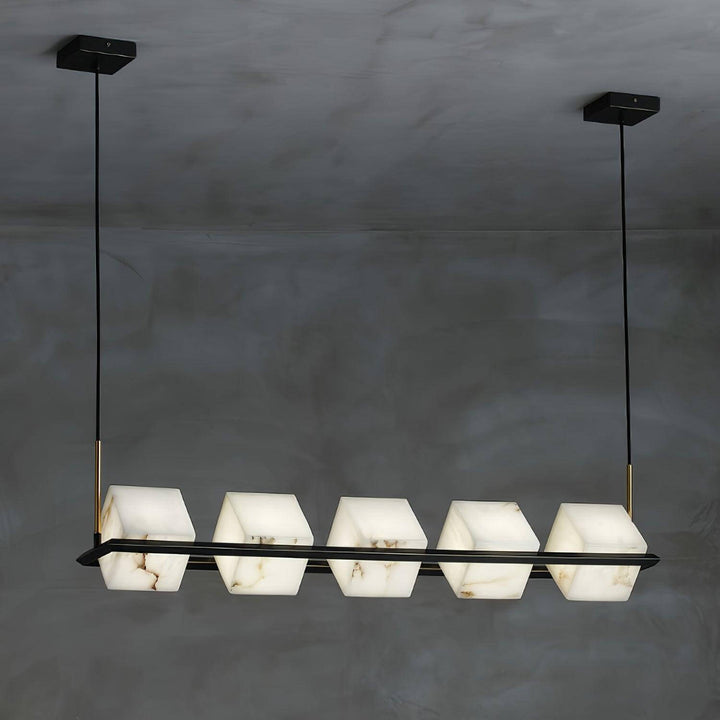 Mid century modern alabaster square box chandelier with six distinct shades against a dark background.